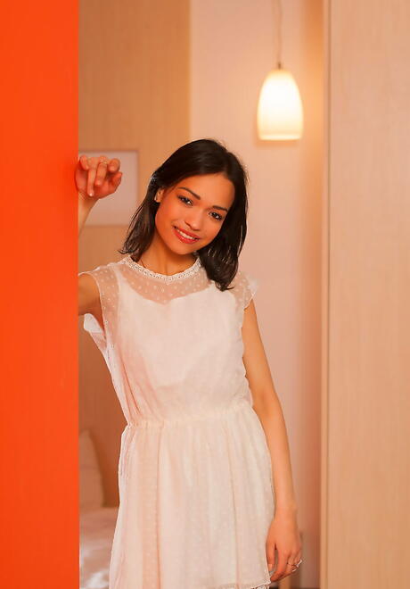 Slim brunette youthful Bansari A in nice skirt unveiling tiny tits and shaved pussy 