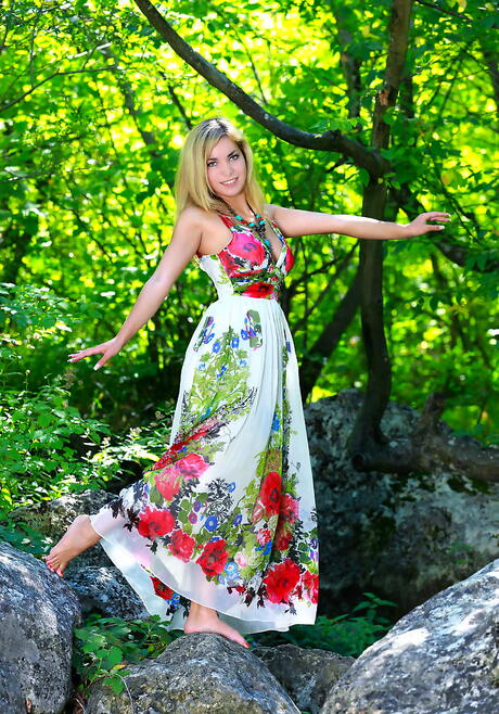 Very attractive blond youthful Valeri B exhibits big titties and bald pussy outdoor