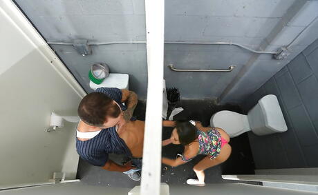 Stunning american Megan Rain blowing huge cock and gets a cum blast in her mouth in bathroom