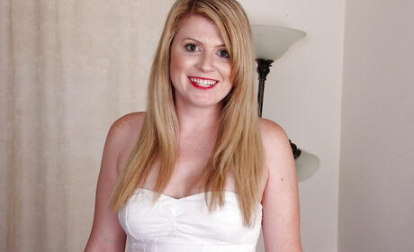 Seductive american blonde aged Lexi Moore in fancy skirt spreading her legs 