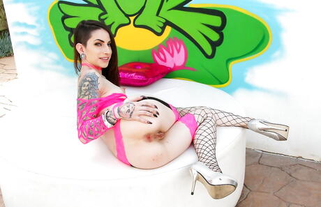 Excellent american brunette bombshell Sheena Rose in hot stockings exhibits her butt and spreads her legs 