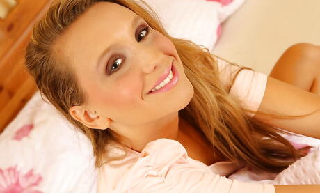 Rangy young Nessy Wild exhibiting big boobs and toying her twat 