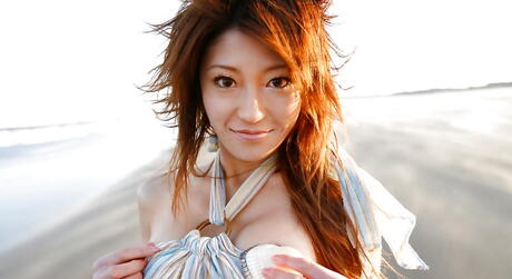 Hot japanese teen Yu Satome in jeans shows big hooters and sexy butt at beach