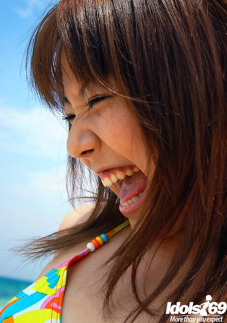 Rangy japanese brunette youthful Chikaho Ito in sexy bikini exhibits her ass at beach