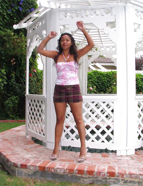 Charming milf Lolli Popp in sexy skirt denudes big knockers and spreads her legs outside