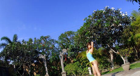 Tempting japanese babe Hikari Hino revealing big boobies and ass near the pool