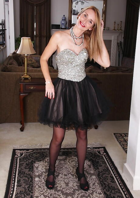 Hot mature Heidi Van Moore in skirt uncovers small tits and spreads her legs 