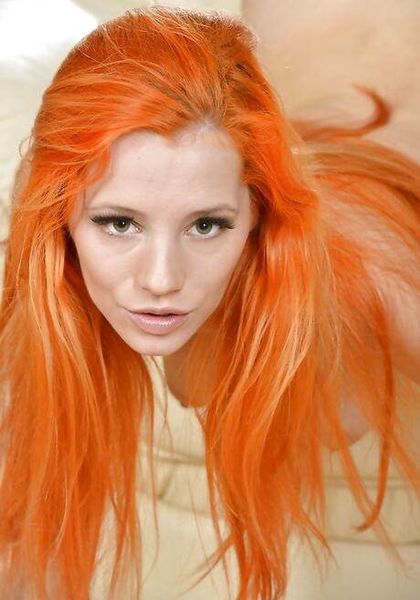 Delightful redheaded porn star Ariel reveals big hooters and masturbates 