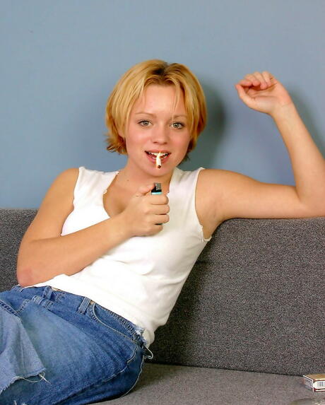 Slender young Madison in sexy skirt loves smoking 