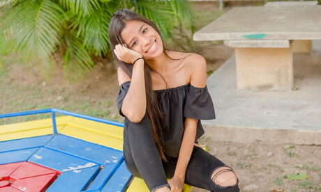 Very attractive latina brunette youthful Karin Torres in sexy posing on camera outdoor