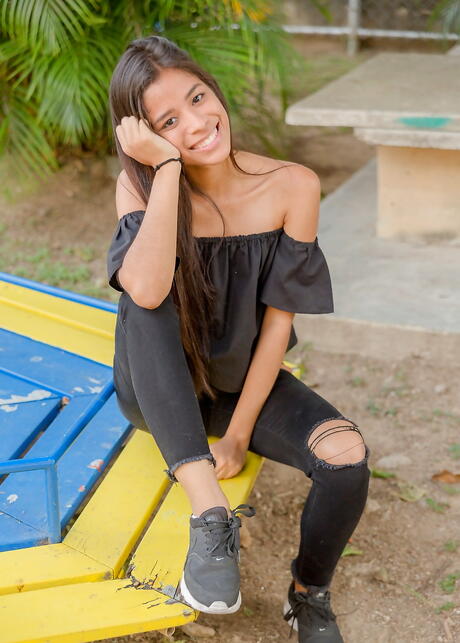 Very attractive latina brunette youthful Karin Torres in sexy posing on camera outdoor