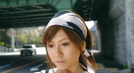 Enchanting japanese babe Yuma Asami in fancy skirt exhibiting big knockers and sexy ass outdoor