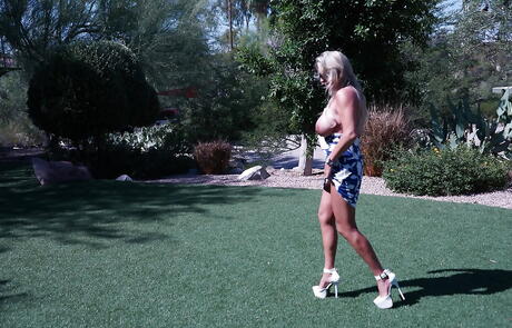 Tempting american housewife Sandra Otterson bares big titties and hot ass at pool