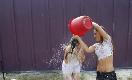 Sultry women Lucy Tyler and Rose Black have lesbian sex outdoor