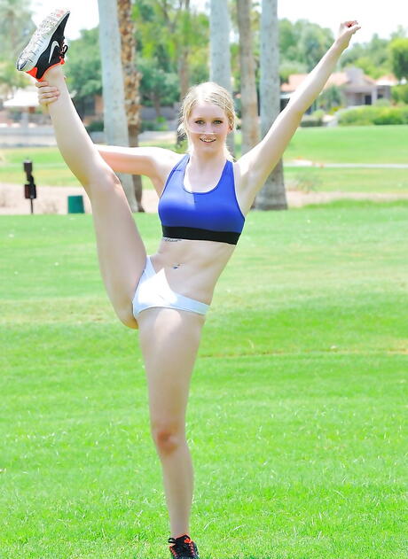 Excellent blonde babe Mandy Snyder exposes big boobies and shaved pussy outdoor