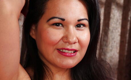 Delightful oriental mature Susie Jhonson in hose exposing small tits and toying 