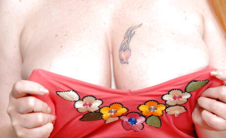 Tempting aged Desiree Deluca bares big hooters and pussy 