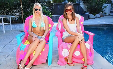 Sexy cuties Vanessa Cage and Riley Reid in bikini make some playful lesbian action outside