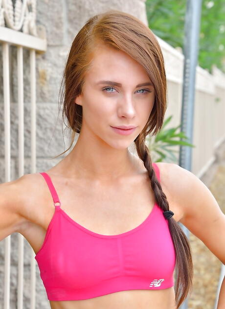 Gracile american redhead teen Anya Olsen in sexy shorts exhibiting her butt and playing with dildo in office