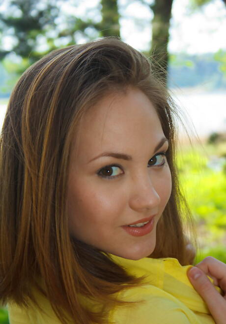 Shapely young Mira D unveiling tiny tits and spreading her legs outside