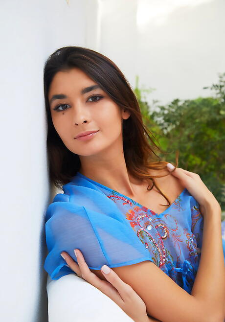 Excellent dark-haired teen Bambi Joli in fancy skirt denudes tiny tits and bald pussy 