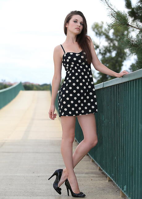 Svelte ukrainian dark-haired Serena Wood in fancy skirt uncovering small tits and butt outdoor