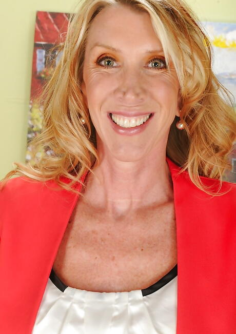 Curious american blonde aged Brynn Hunter in hot underwear baring big hooters and spreading her legs 