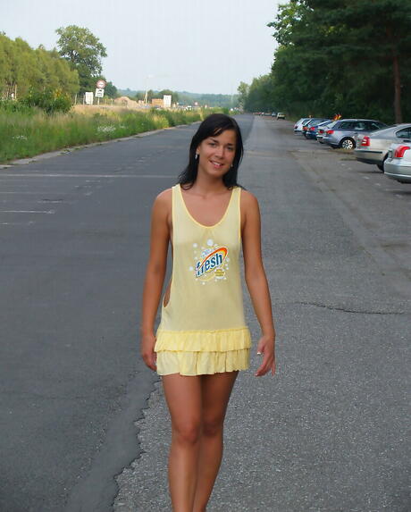 Luscious brunette young Stephanie in sexy skirt exhibits her ass outdoor