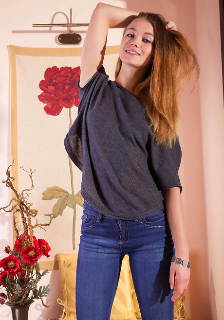 Sexy blonde young Solveig bares small tits and bald pussy 