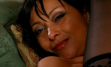 Enchanting milf Donna Collins in hot stockings denudes big boobies and hot ass 