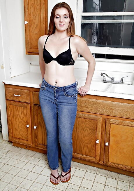 Hot american young Stacey Leann in jeans bares tiny tits and jerks off in kitchen