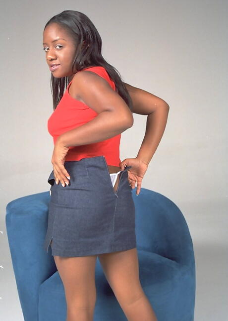 Adorable milf Andrea in skirt denudes big boobies and bald pussy 