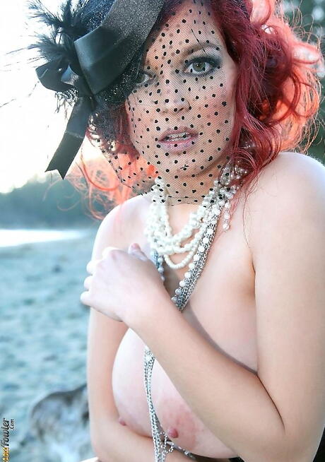 Excellent american redheaded porn star Tessa Fowler posing in skirt on camera at beach