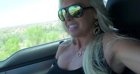 Sexy american blond housewife Sandra Otterson work with hand on rod and takes a cumshot in her mouth outdoor