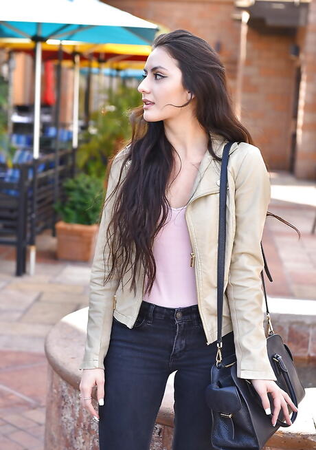 Excellent brunette babe Natalie baring small tits and spreading her legs outside