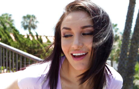 Enchanting american brunette cutie Gabriella Paltrova revealing big titties and butt outside