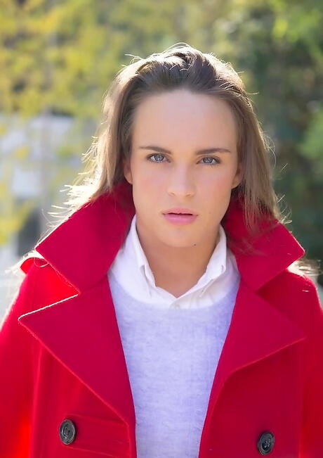 Slim american youthful Teal Conrad in skirt showing big knockers and hot ass outside