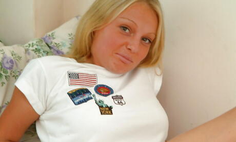 Slim american blond young Asia in fancy shorts exposing her ass and spreading her legs 