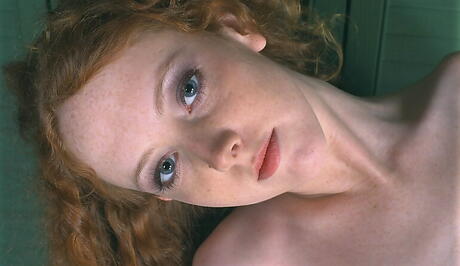 Stunning redheaded young Dawn exposing tiny tits and spreading her legs 