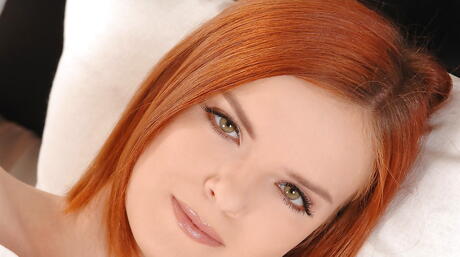 Slender redheaded youthful Denisa unveiling small tits and masturbating 