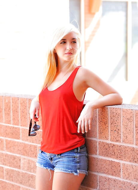 Stunning blond young Jayde showing small tits and spreading her legs outside