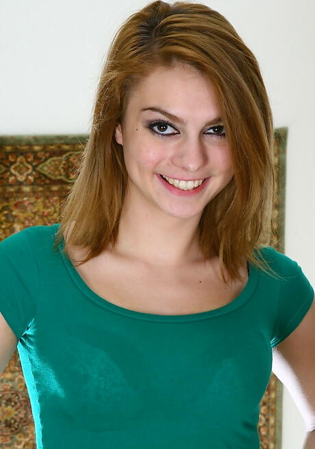 Very attractive young Veronica exhibits small tits and bald pussy 