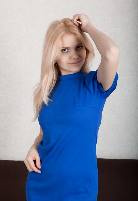 Shapely blond teen Madlen in fancy skirt baring tiny tits and spreading her legs 