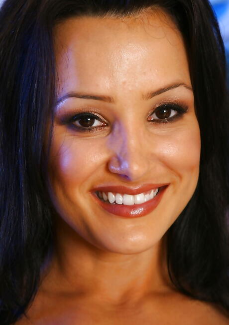 Attractive american dark hair milf Lisa Ann showing big knockers and spreading her legs 