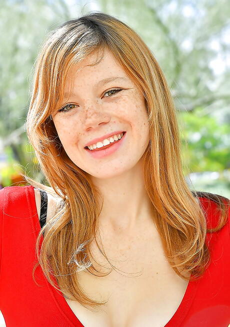 Excellent red-haired babe Mia Collins exhibiting big knockers and nice pussy outside