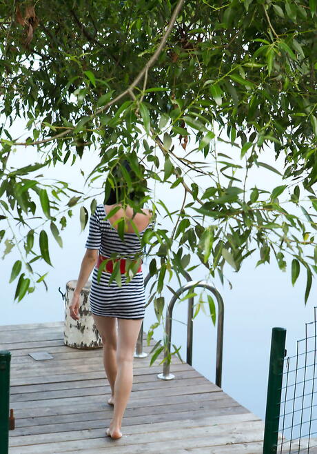 Sexy dark-haired young Janelle B in nice skirt reveals tiny tits and spreads her legs outdoor