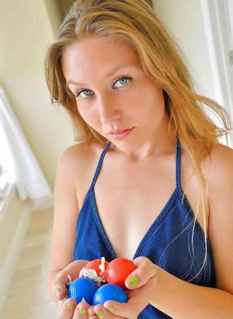 Sexy blond young Bre Blu bares her butt and toys her twat outside