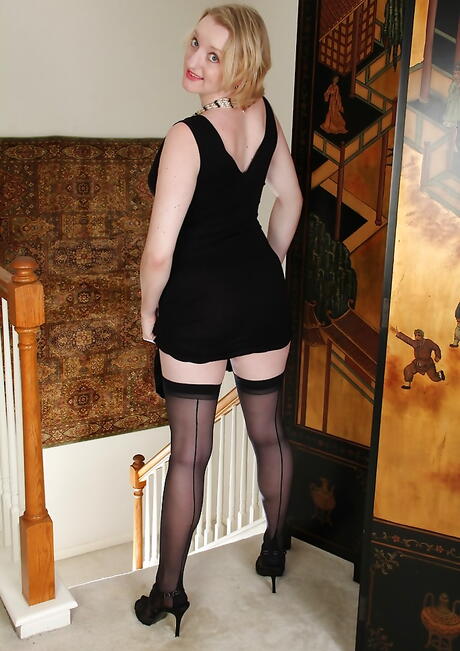 Curious blond mature Anya Volcov in nice skirt exposes big tits and hairy pussy 