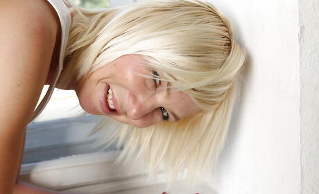 Sultry blond older Emilia exposes big titties and spreads her legs 