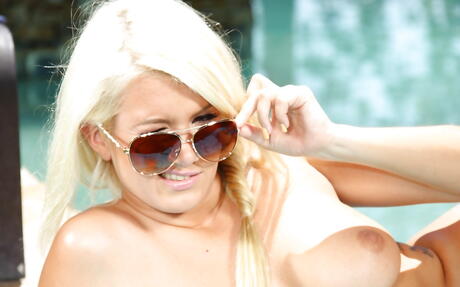 Very attractive blond milf Layla Price in beautiful bikini exhibits big boobs and sexy ass at pool